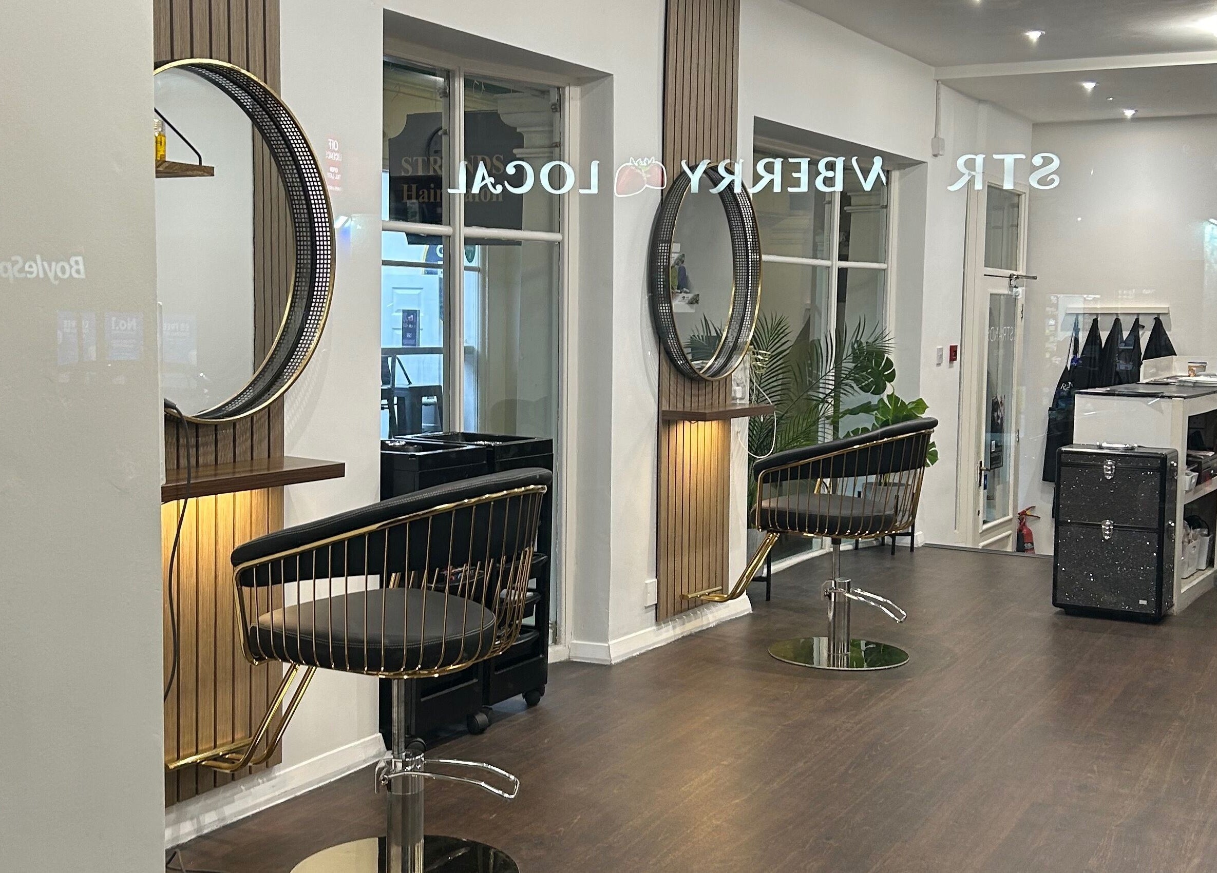 Strands salon Newport Pagnell -Jen interior featuring stylish chairs and mirrors in Newport Pagnell, England, GB.
