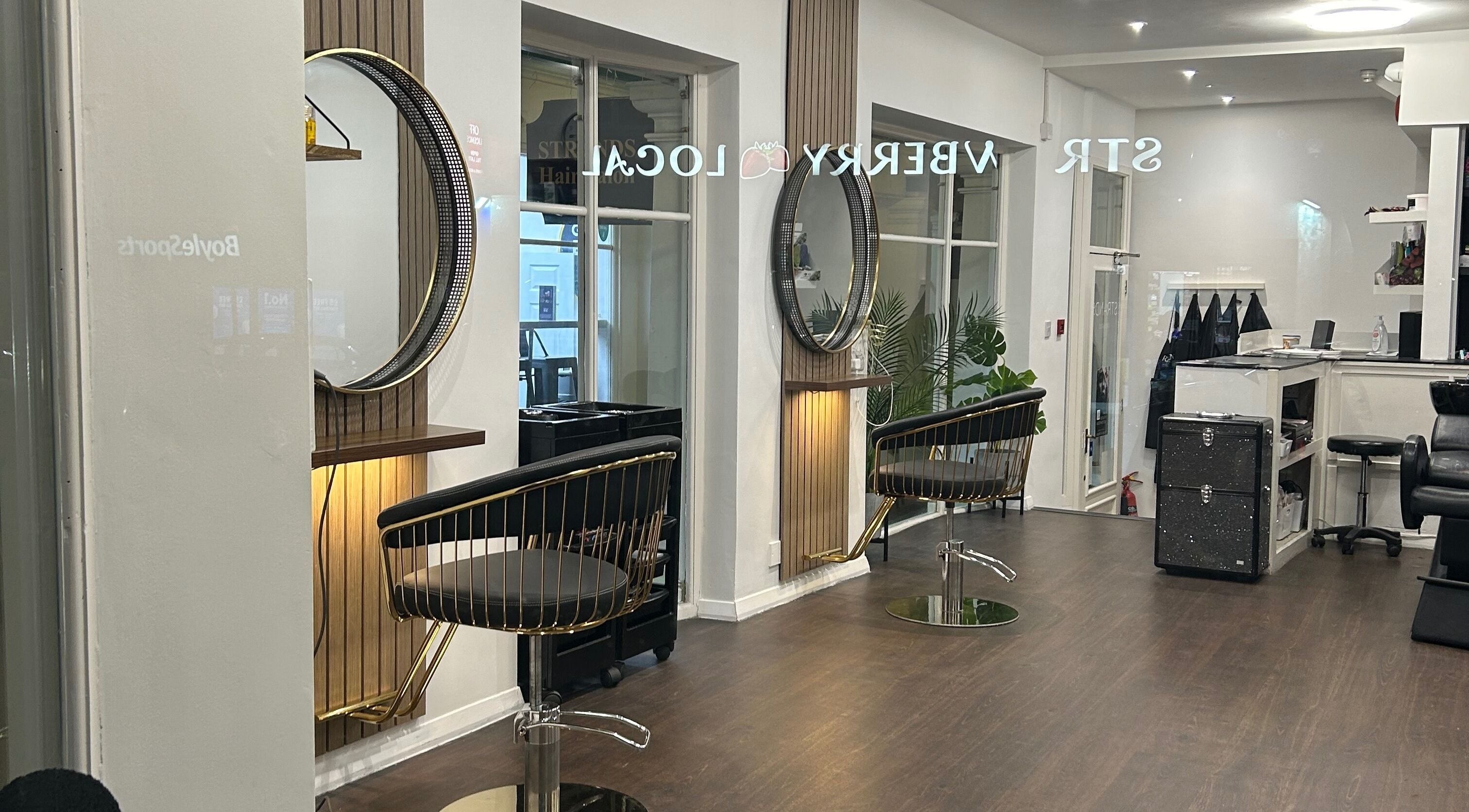Strands salon Newport Pagnell -Jen interior featuring stylish chairs and mirrors in Newport Pagnell, England, GB.