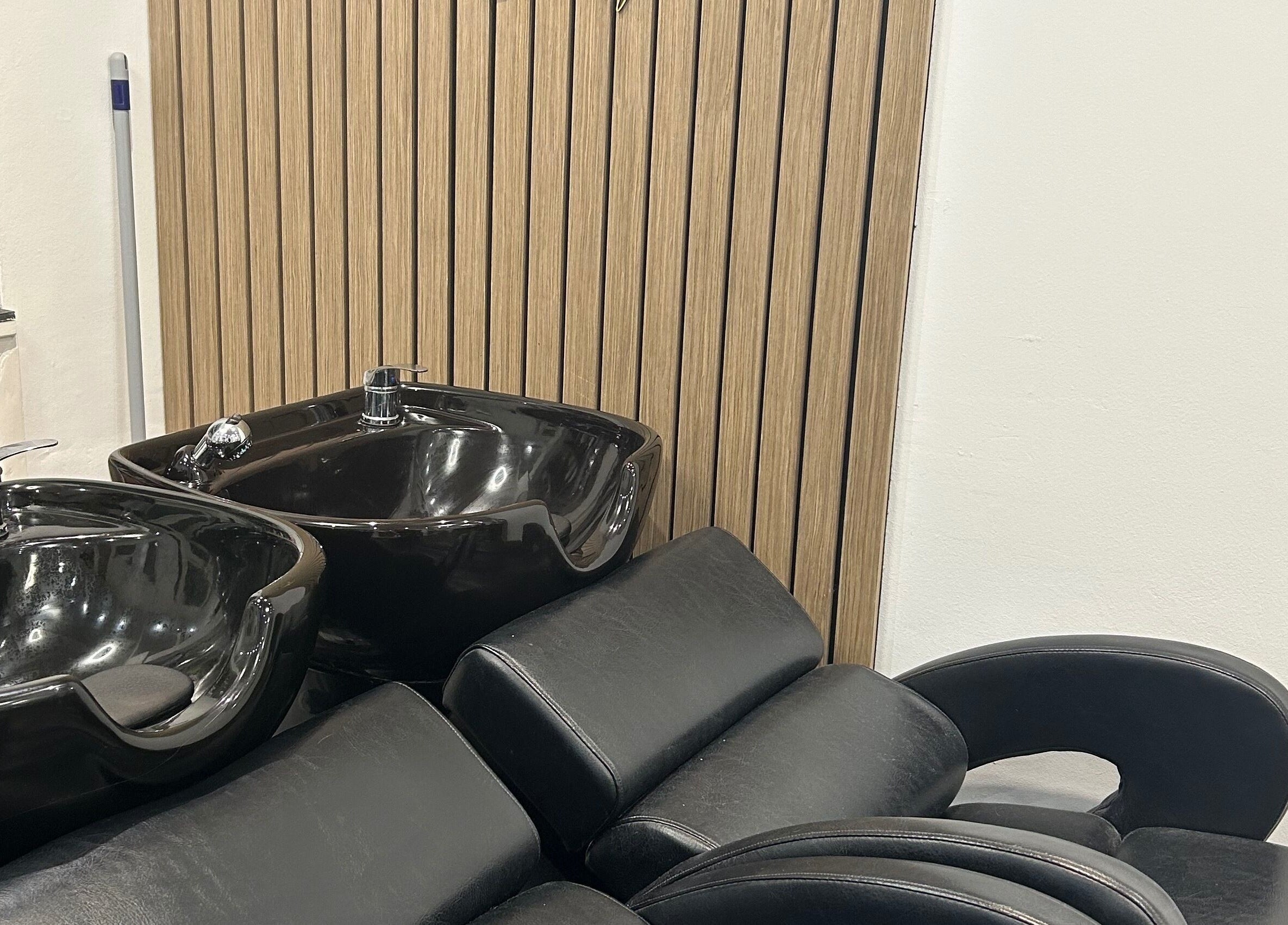 Modern washbasins at Strands salon Newport Pagnell -Jen, Newport Pagnell, England, GB, offer luxury and style.