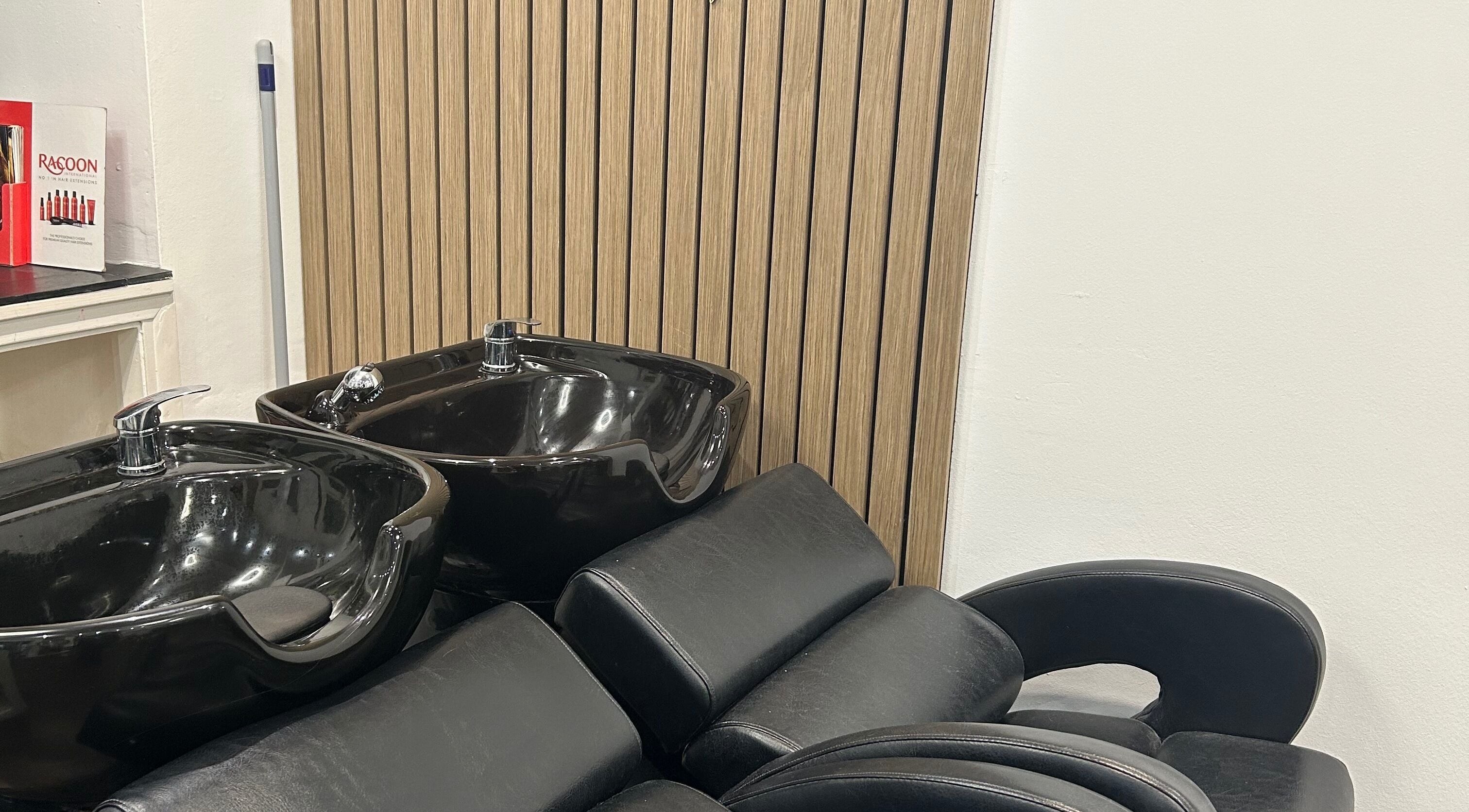 Modern washbasins at Strands salon Newport Pagnell -Jen, Newport Pagnell, England, GB, offer luxury and style.