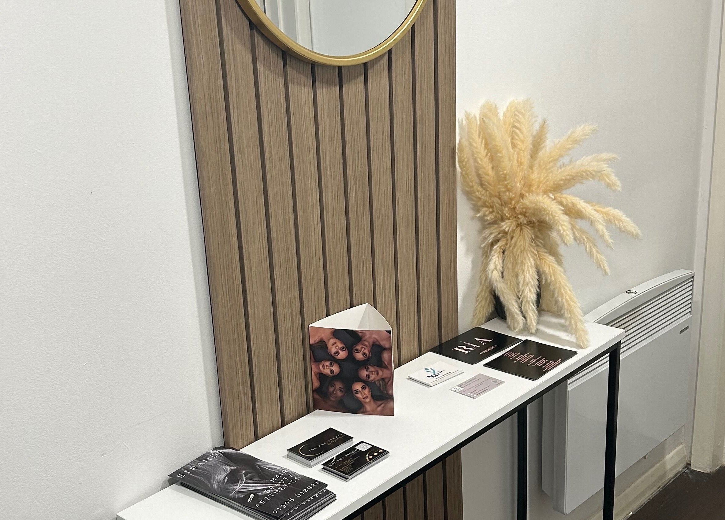 Strands salon Newport Pagnell -Jen features a stylish entry table with decor in Newport Pagnell, England, GB.