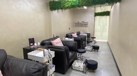Relaxing pedicure area at Salon 971, Dubai, Dubai, AE, with plush chairs and green decor.