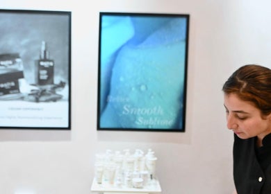 Professional at Salon 971 in Dubai preparing beauty products for clients.