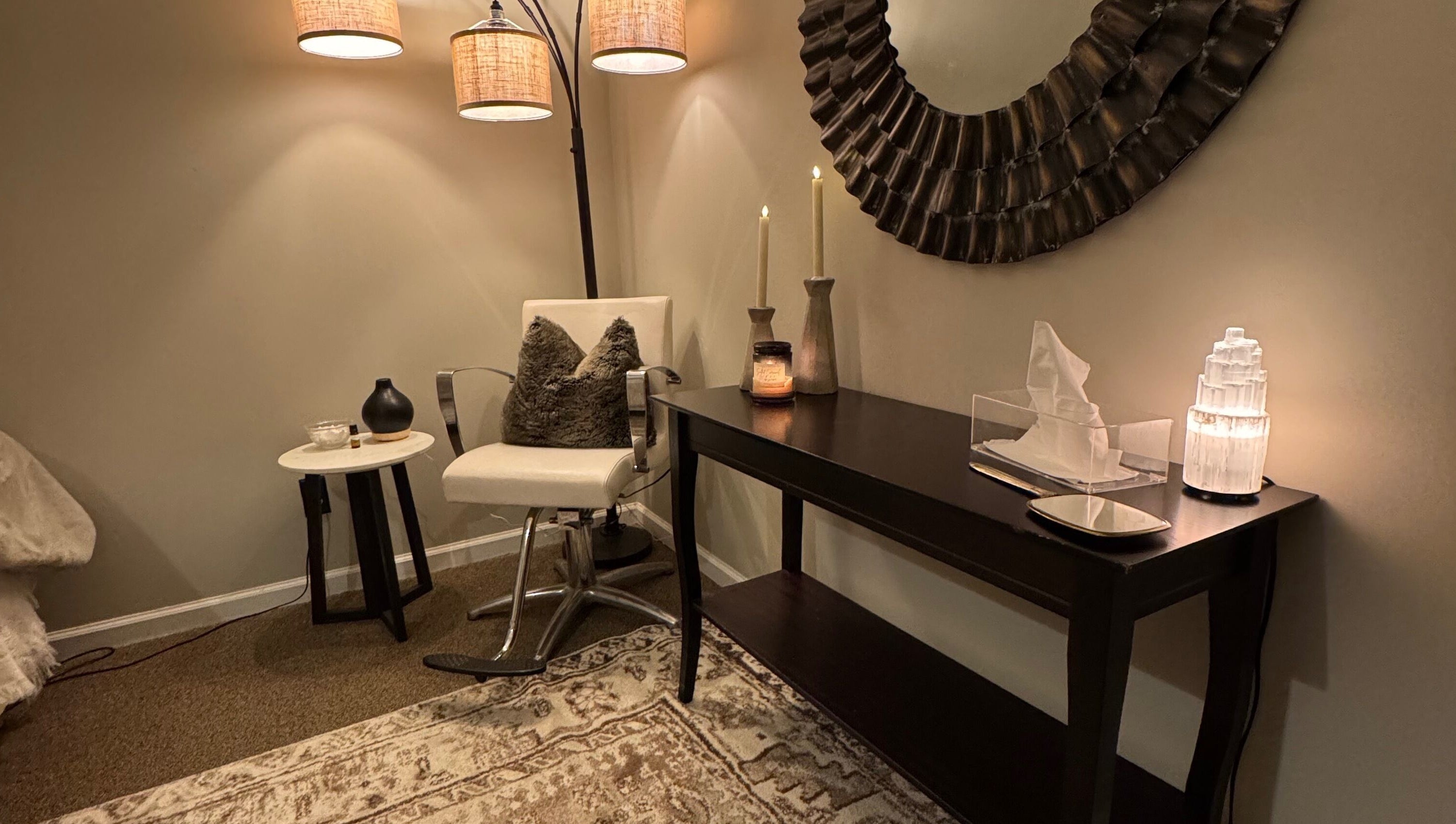 Inviting seating area at Brow Babes GA in Gainesville, Georgia, US showcasing modern decor and soft lighting.