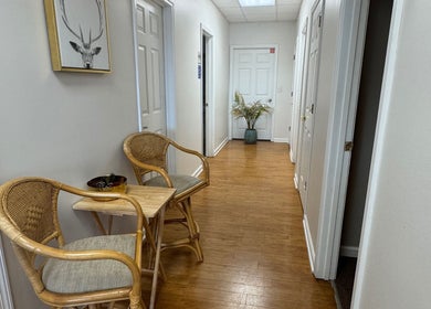 Inviting hallway with wicker chairs at Brow Babes GA, Gainesville, Georgia, US.