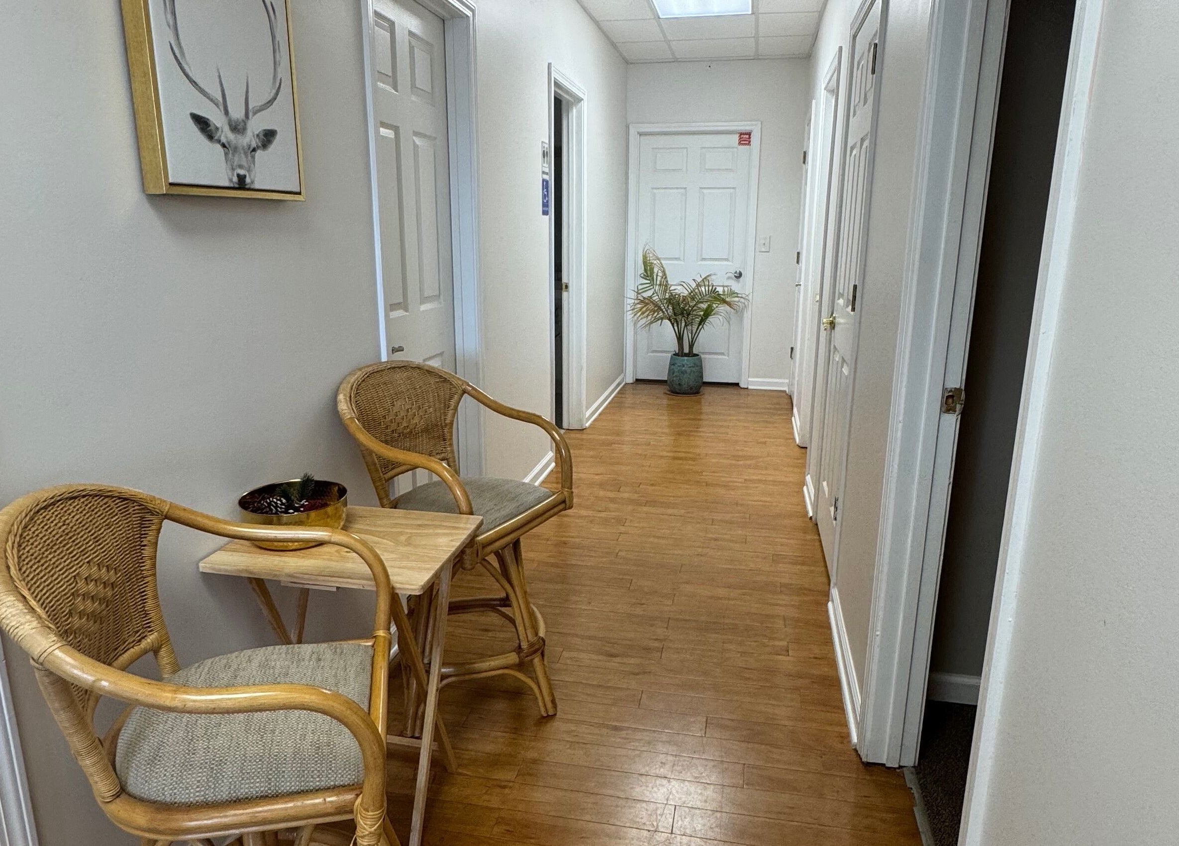 Inviting hallway with wicker chairs at Brow Babes GA, Gainesville, Georgia, US.