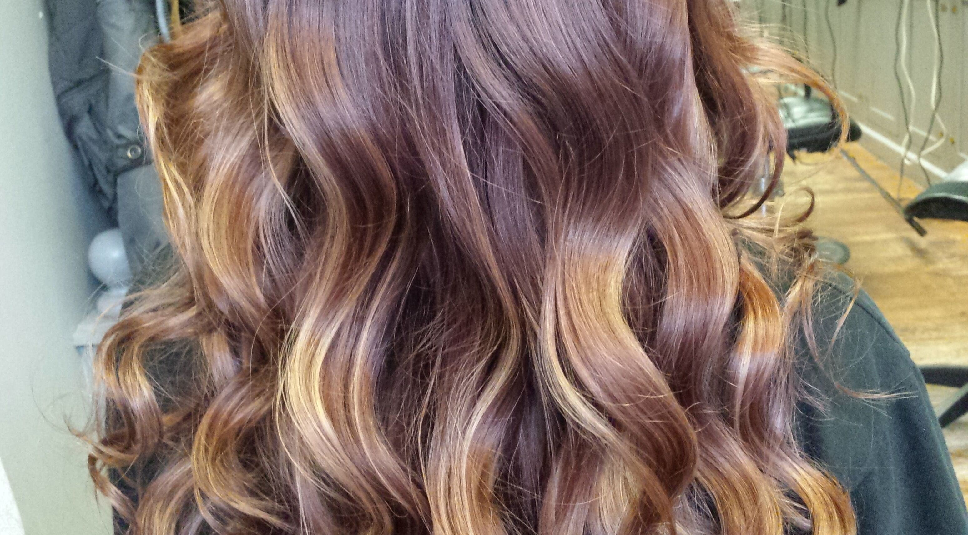 Beautiful brunette waves styled at Rebekka's Hair Salon, Ramara, Ontario, CA, showcasing expert hair coloring.