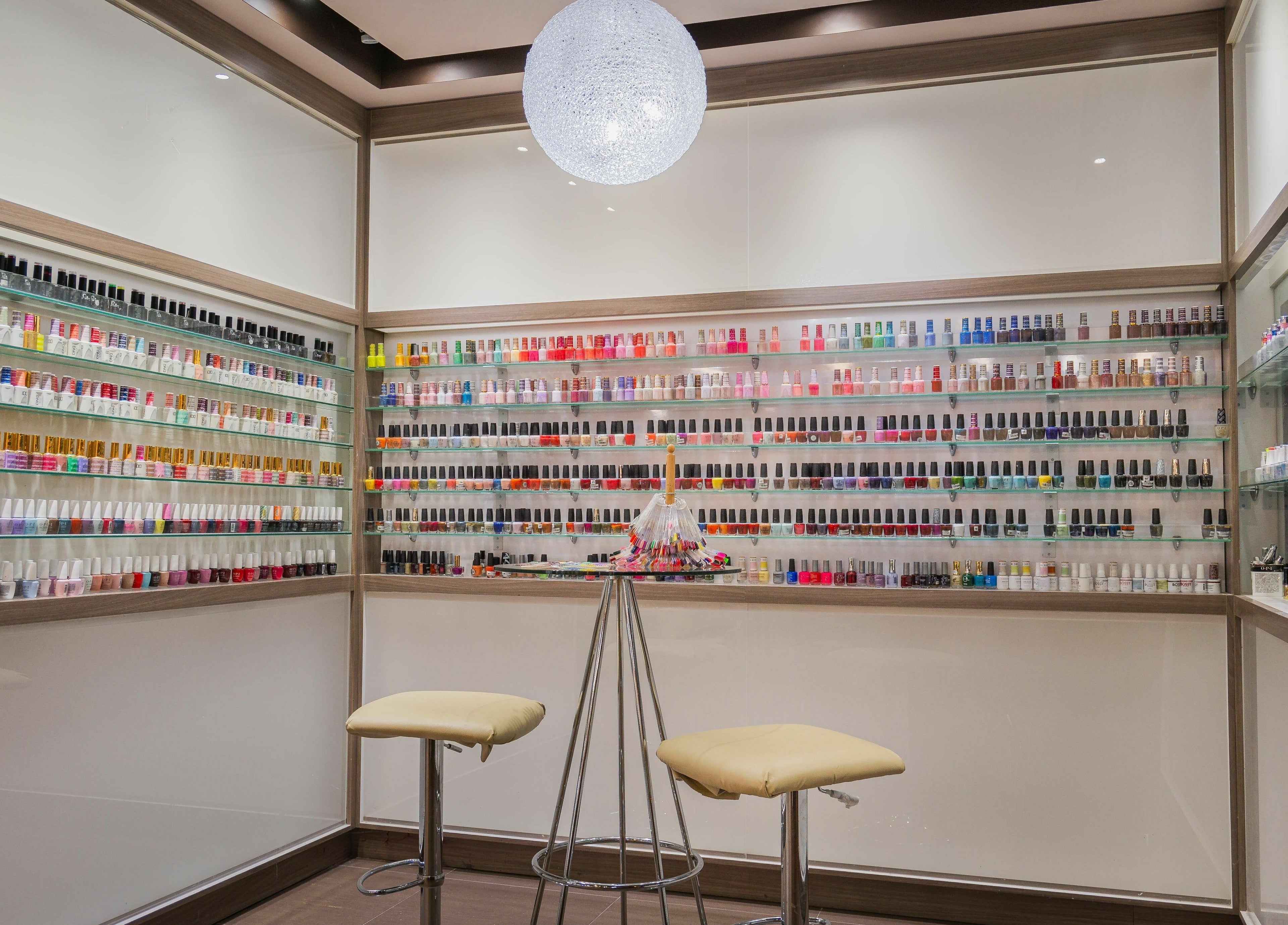 Vibrant nail polish display at Nail One & Spa, Markham, Ontario, CA, showcasing a wide color range.