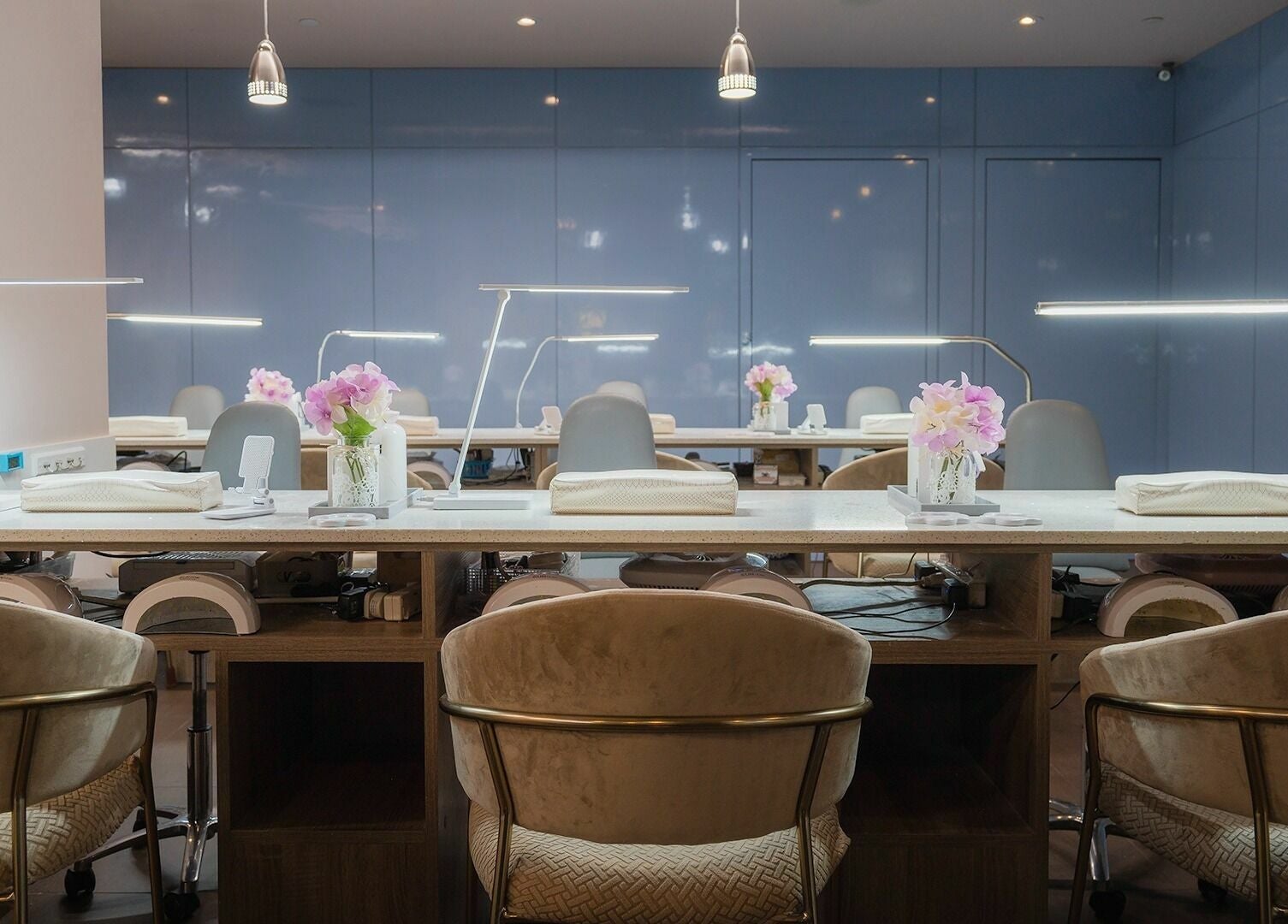 Elegant nail treatment area at Nail One & Spa, Markham, Ontario, CA, featuring plush seating and modern amenities.