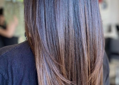 Sleek, straight hairstyle at Bridget Nottingham Hair Design, Huntington Beach, California, US.