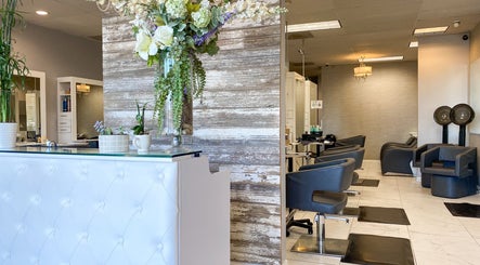Bridget Nottingham Hair Design's chic interior in Huntington Beach, California, US, showcasing luxury salon chairs.