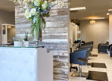 Elegant interior of Bridget Nottingham Hair Design in Huntington Beach, California, US showcasing chic salon chairs.