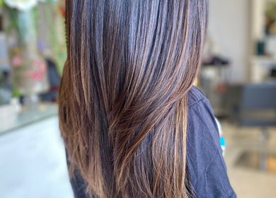 Smooth, silky hair styled at Bridget Nottingham Hair Design in Huntington Beach, California, US.