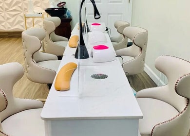 Luxurious nail care station at De'Bleu Hair Salon and Spa, Savannah, Grand Cayman, KY, featuring chic seating.