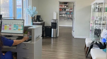 Reception area at De'Bleu Hair Salon and Spa, Savannah, Grand Cayman, KY, showcasing a modern and inviting interior.