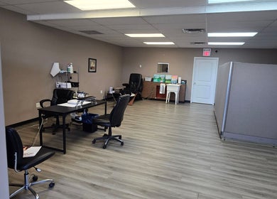 Spacious interior of Sugar and Spice Esthetics in Ponoka, Alberta, CA with modern decor and workstations.
