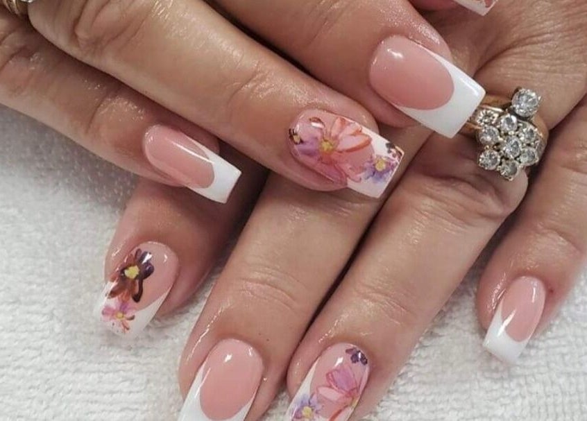 Elegant floral nail art at Sugar and Spice Esthetics, Ponoka, Alberta, CA. Perfect for beauty enthusiasts.