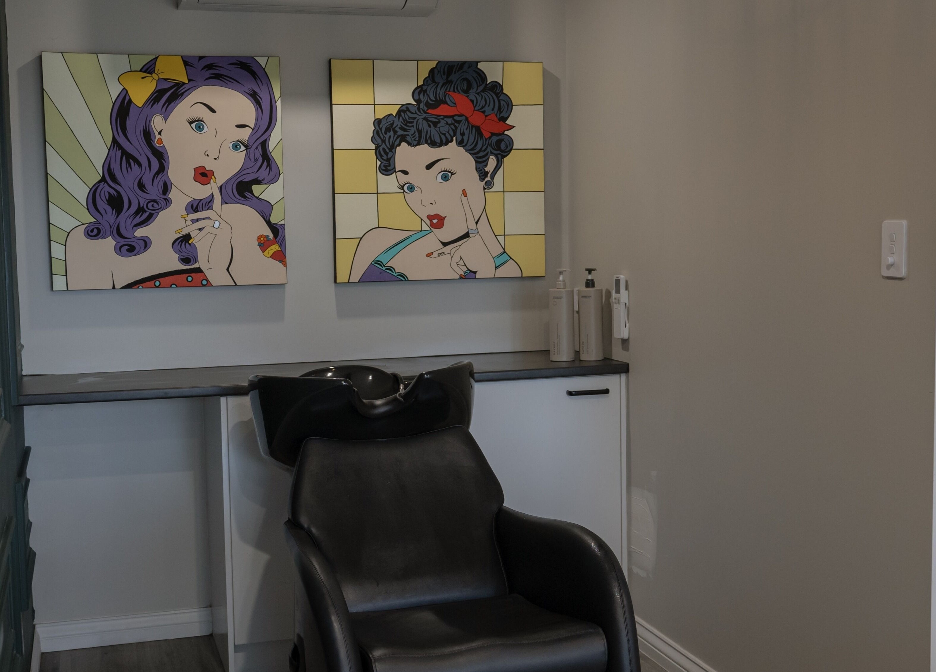 Stylish hair washing station at Scarlet Hair Studio, Tauranga, Bay of Plenty, NZ, featuring pop art decor.
