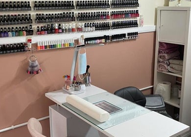 Nail station at House of Beauty by Tanya, Peterborough, England, showcasing polish collection and tools.