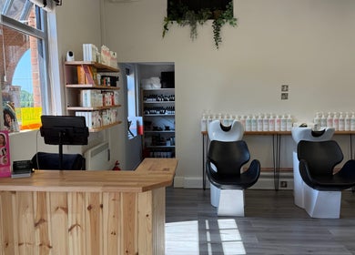 Reception and hair wash area at Willow Hair and Wellbeing in Woodbury, England, GB.