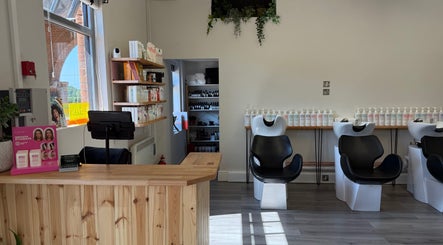 Reception and hair wash area at Willow Hair and Wellbeing in Woodbury, England, GB.
