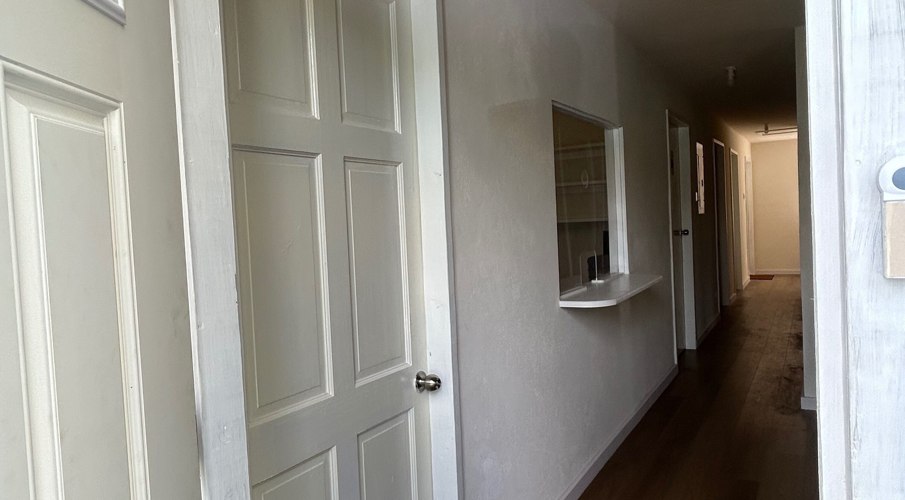 Serene hallway at Solitude Esthetics in Oistins, Christ Church, BB, inviting calm and relaxation.