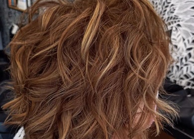 Stylish wavy hair at Hair by Irian, Johannesburg, Gauteng, ZA. Perfect blend of brown and highlights.