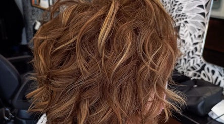 Stylish wavy hair at Hair by Irian, Johannesburg, Gauteng, ZA. Perfect blend of brown and highlights.