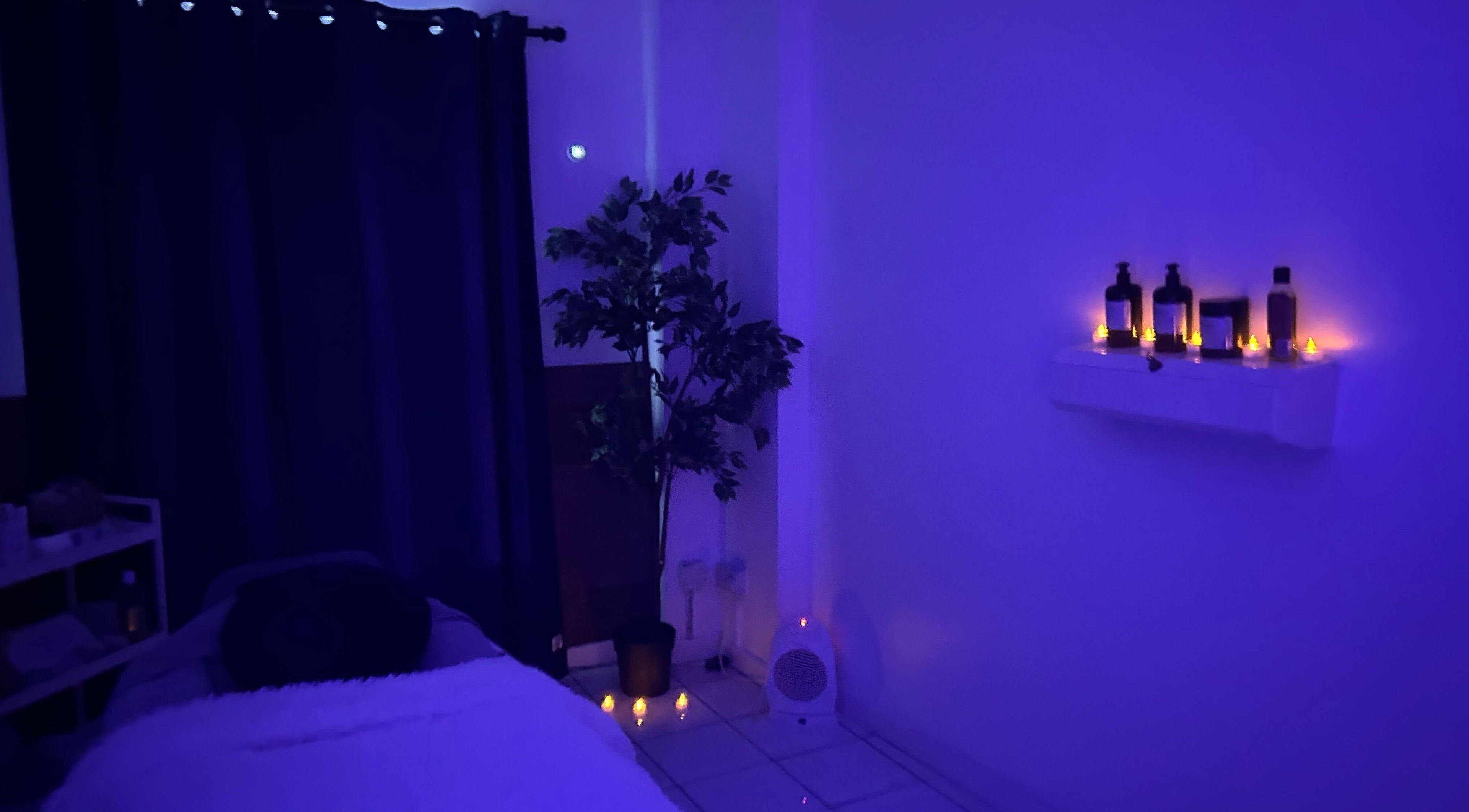 A tranquil room at The Facial Spa at Bank House, Llantwit Major, Wales, GB with dim lighting and calming decor.