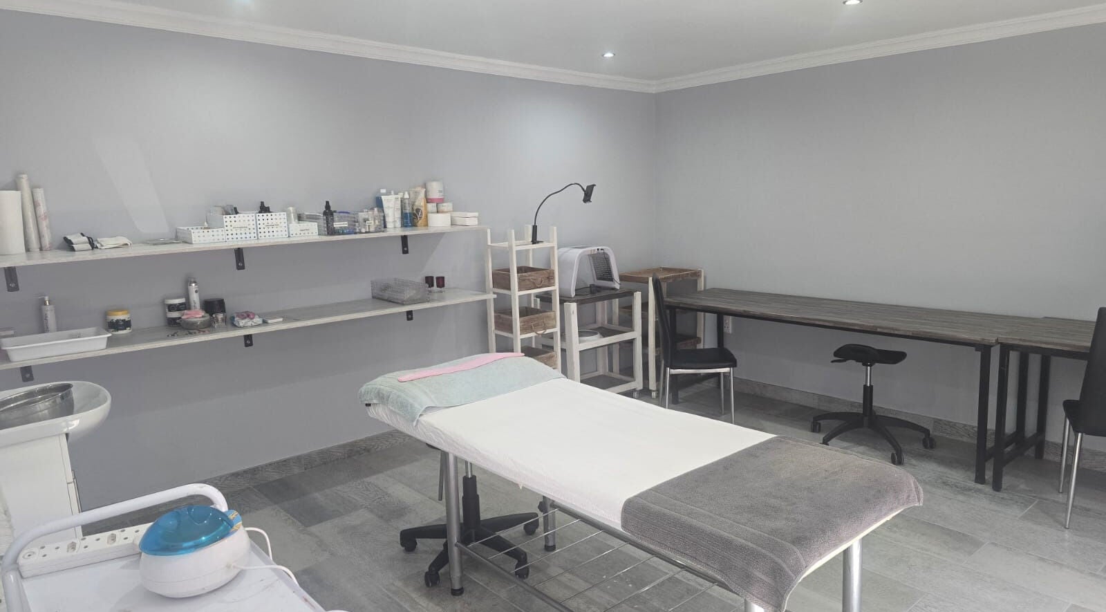 Tranquil treatment room at Studio A - Skin Aesthetics in Roodepoort, Gauteng, ZA, featuring cozy massage bed.