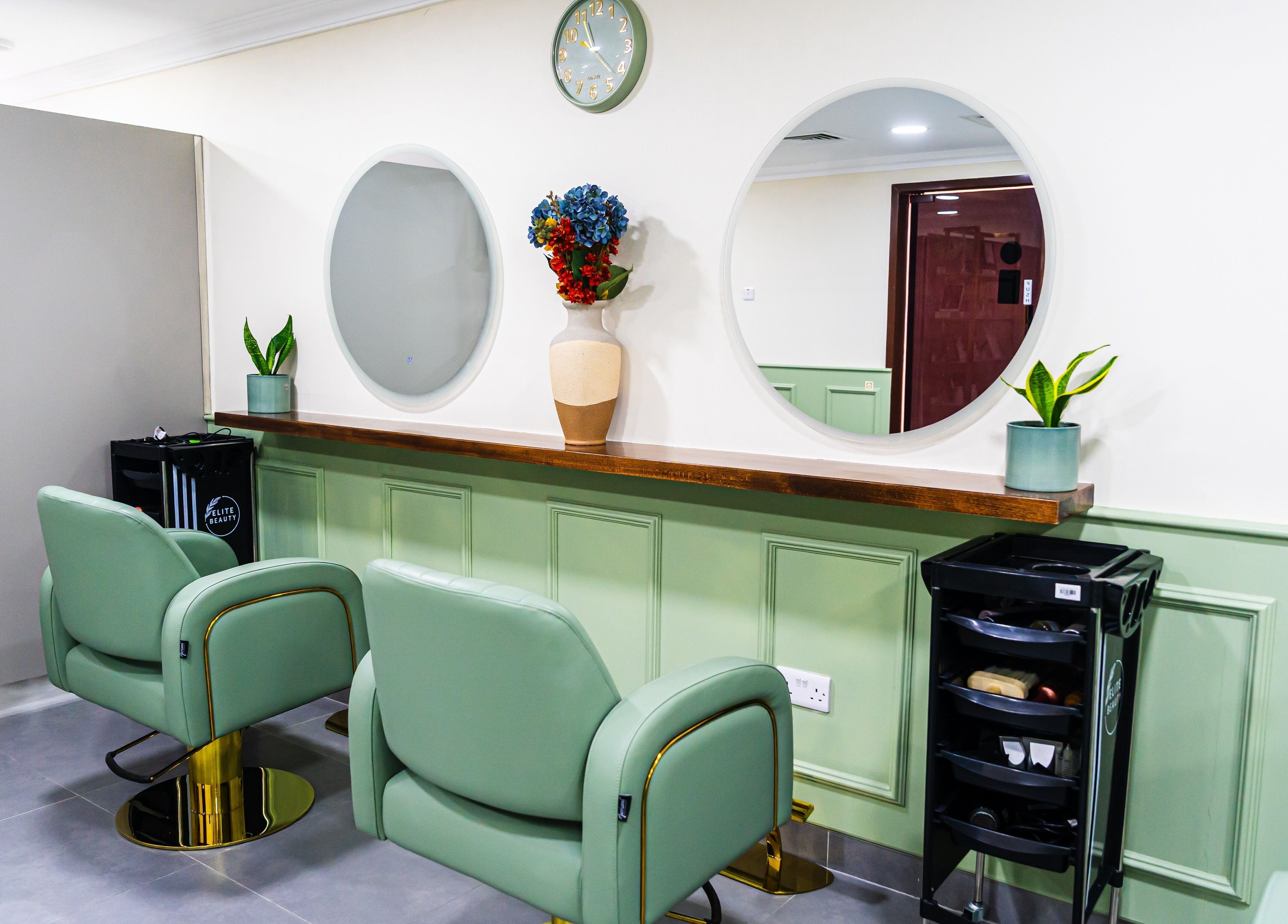 Chic styling chairs and mirrors at Wandies Hair and Beauty Salon, Sharjah, AE, offering serene ambiance.