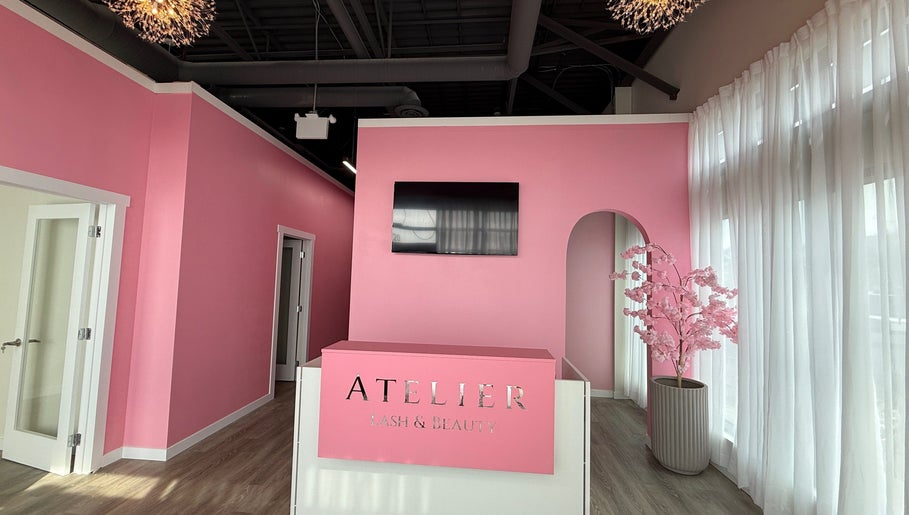 Chic pink reception at The Beauty Nurs in Edmonton, Alberta, CA, featuring modern decor and ambient lighting.