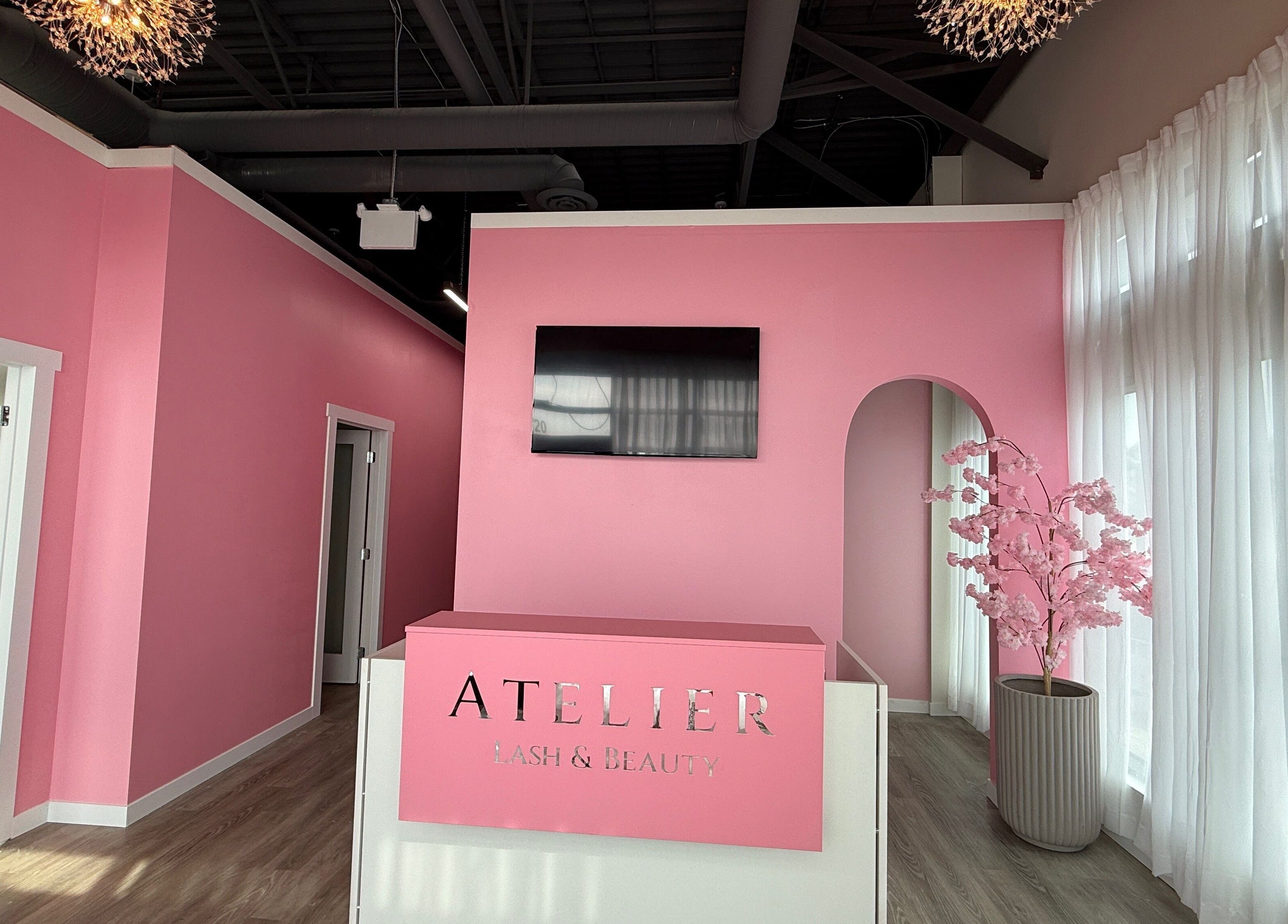 Chic pink reception at The Beauty Nurs in Edmonton, Alberta, CA, featuring modern decor and ambient lighting.