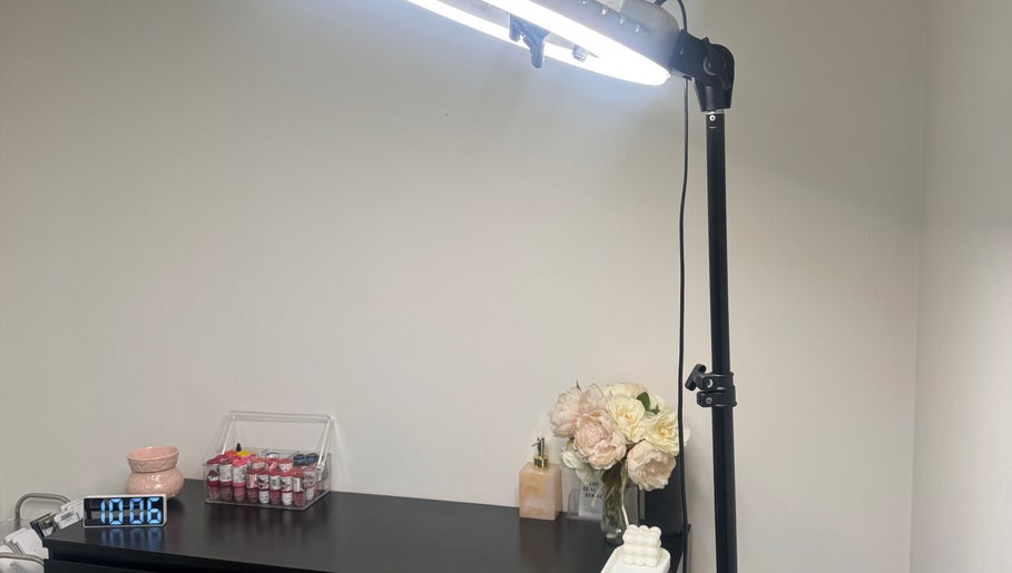 Elegant setup at The Beauty Room by Taylor Marie, Parramatta, NSW with light, flowers, and products.