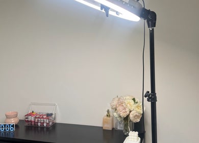 Elegant setup at The Beauty Room by Taylor Marie, Parramatta, NSW with light, flowers, and products.