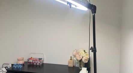 Elegant setup at The Beauty Room by Taylor Marie, Parramatta, NSW with light, flowers, and products.