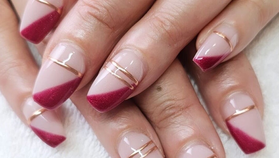 Stunning red and gold nails at Beautiful You - Nails and Beauty, Rotorua, Bay Of Plenty, NZ.