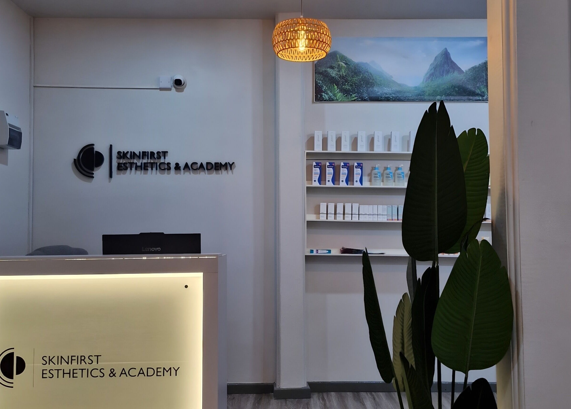 Reception at SkinFirst Esthetics & Academy, La Tourney, Vieux Fort, LC with elegant decor and product display.