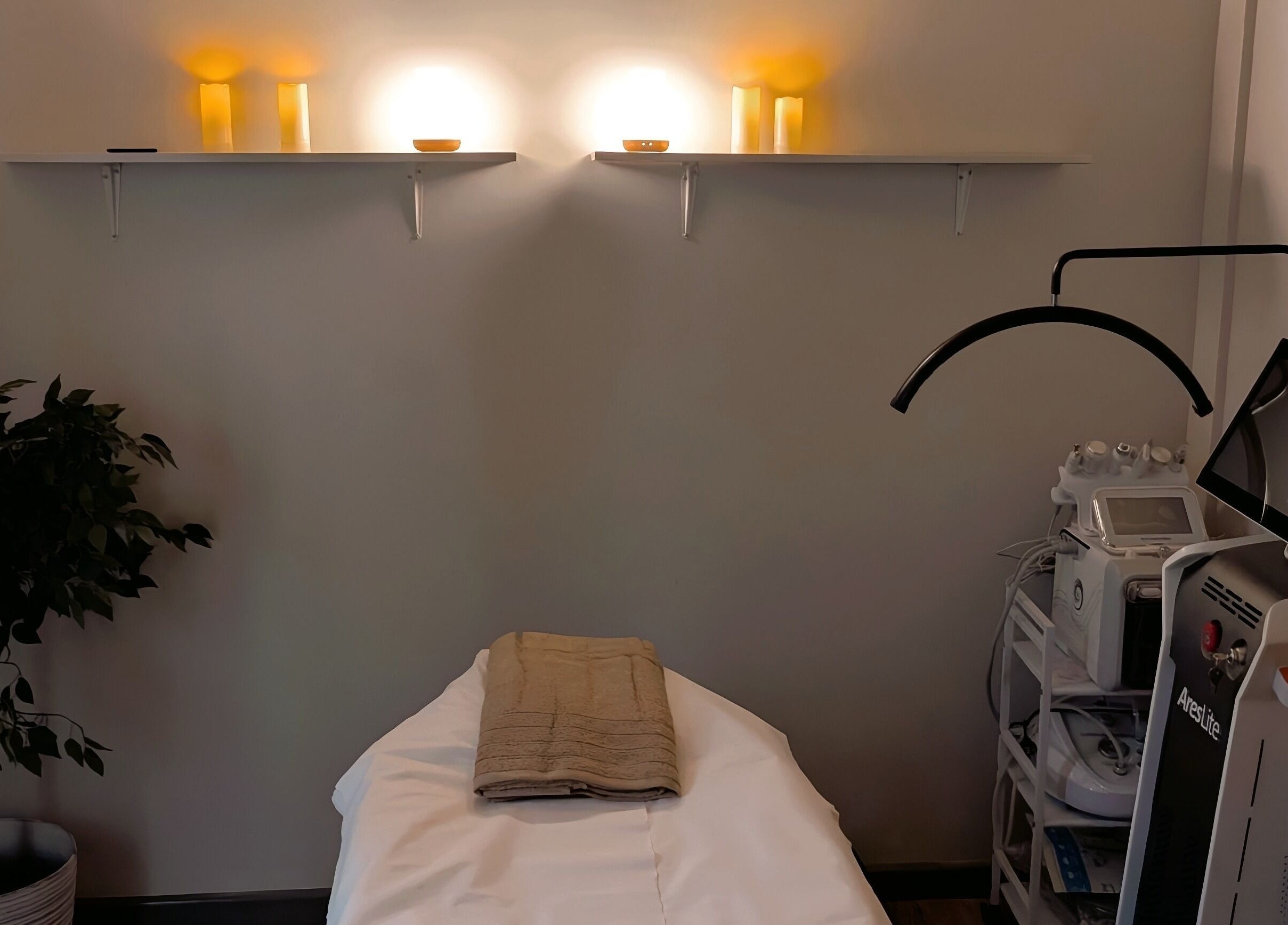 Relaxing treatment room at SkinFirst Esthetics & Academy, La Tourney, Vieux Fort, LC, featuring a cozy bed.
