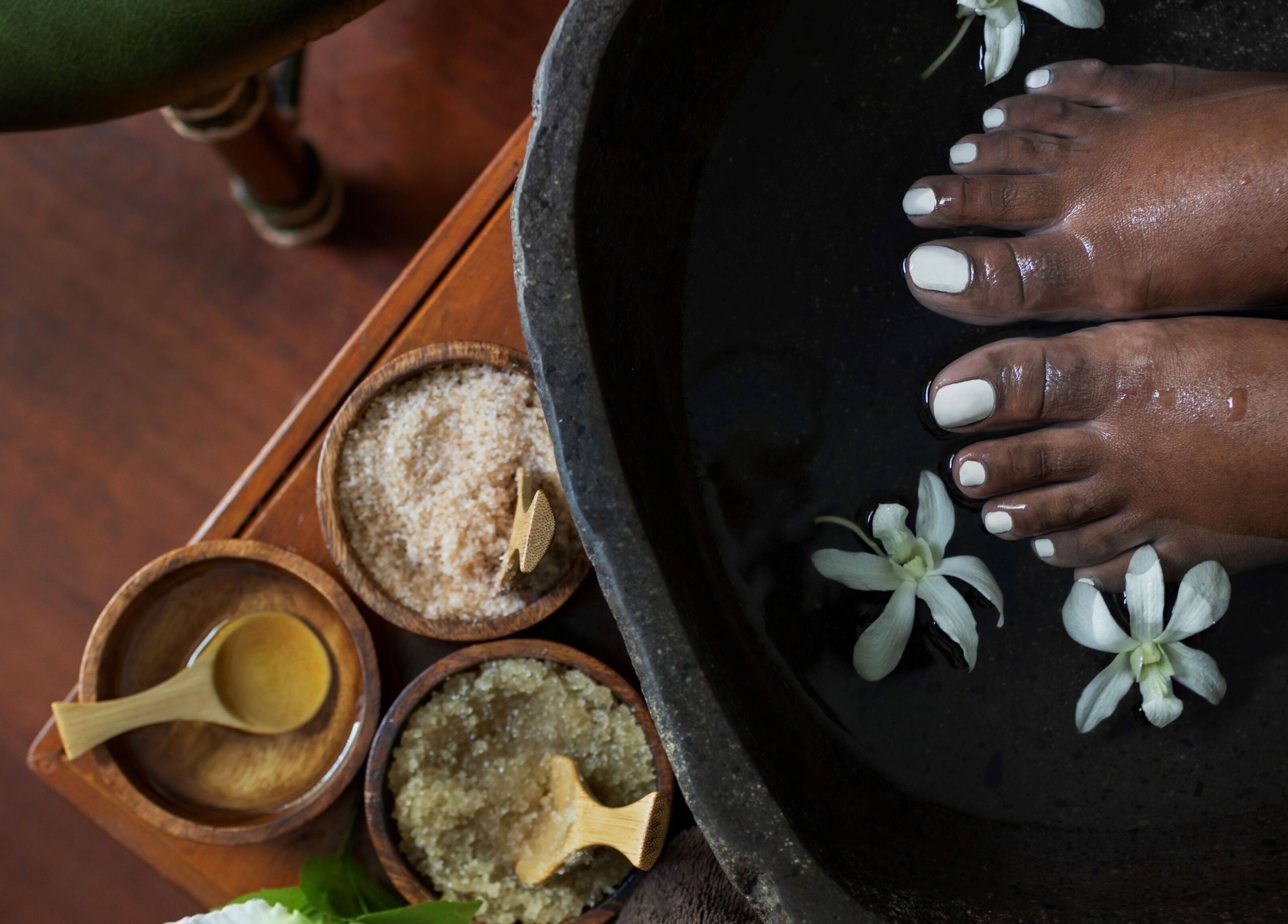 Relaxing foot spa at Sofitel Fiji Resort & Spa, Denarau Island, Western Division, FJ with flowers and natural scrubs.