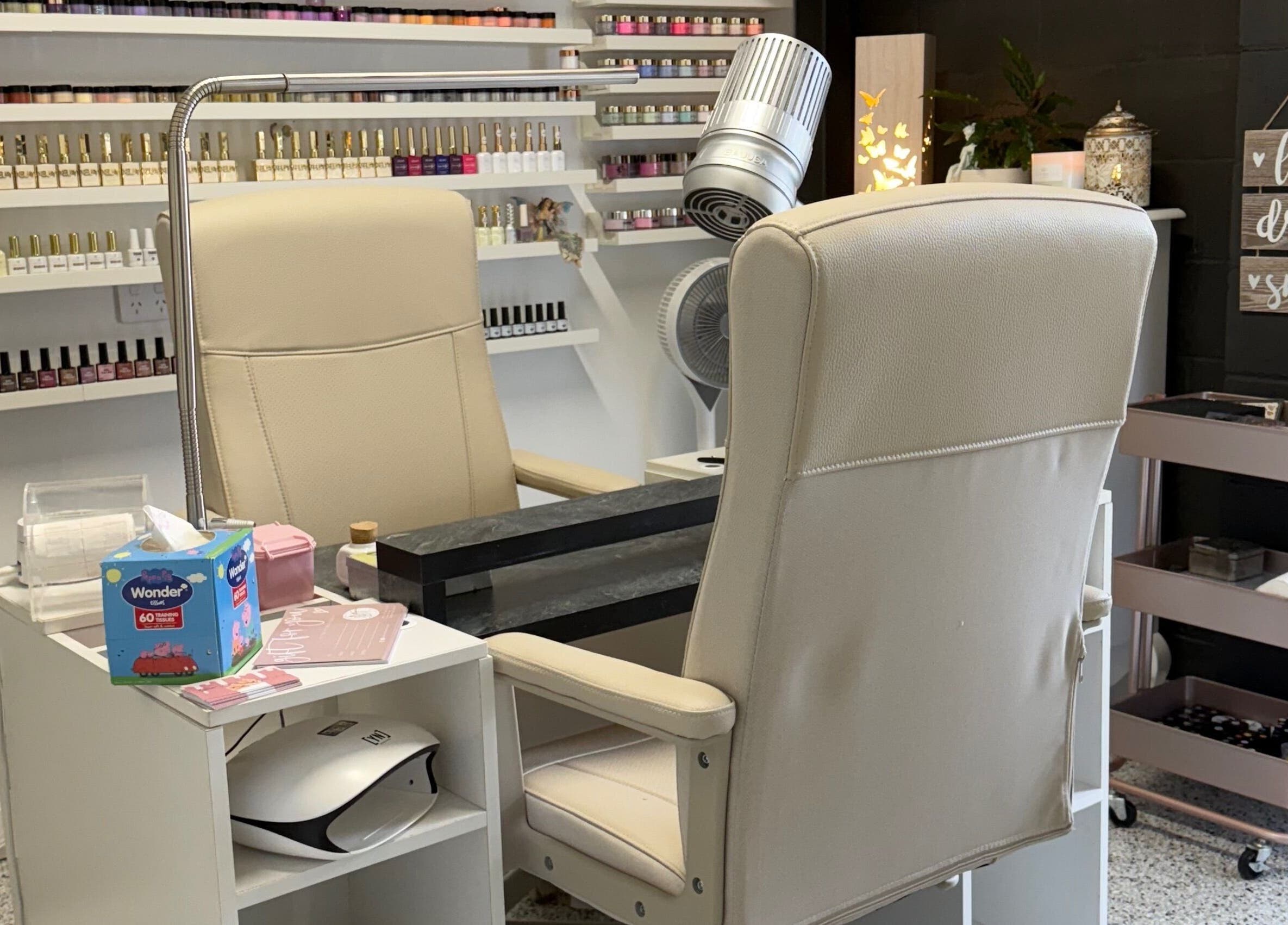 Elegant nail station at Glam Time Nail Studio in Molendinar, Queensland, AU, showcasing a range of nail polish.