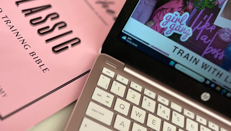 Close-up of a laptop and training materials at Lashed By Rachel Emma, Cradley Heath, England, GB.