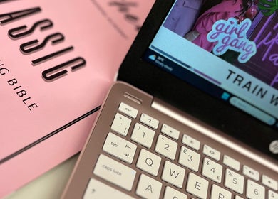 Close-up of a laptop and training materials at Lashed By Rachel Emma, Cradley Heath, England, GB.