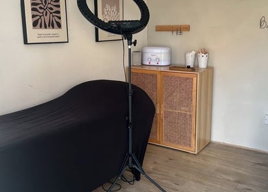 Cozy treatment room at Beauty by Chloe in Hopton, England, GB featuring a massage table and elegant decor.