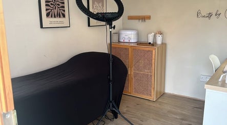 Cozy treatment room at Beauty by Chloe in Hopton, England, GB featuring a massage table and elegant decor.