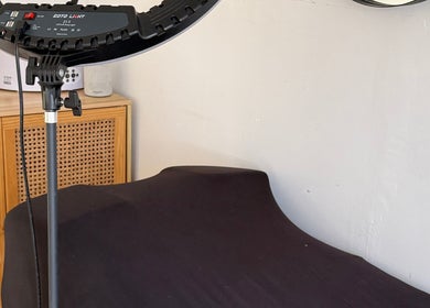 Calming treatment room at Beauty by Chloe in Hopton, England, GB, featuring a massage bed and professional lighting.