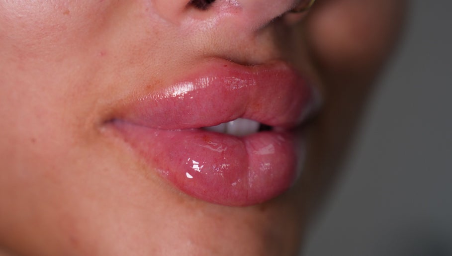 Close-up of glossy lips after treatment at Face by Demi, Hook, England, GB.