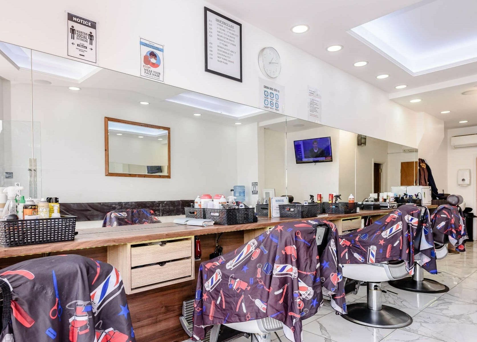 Clean Cuts London interior showcasing sleek barber chairs and mirrors. London, England, GB.