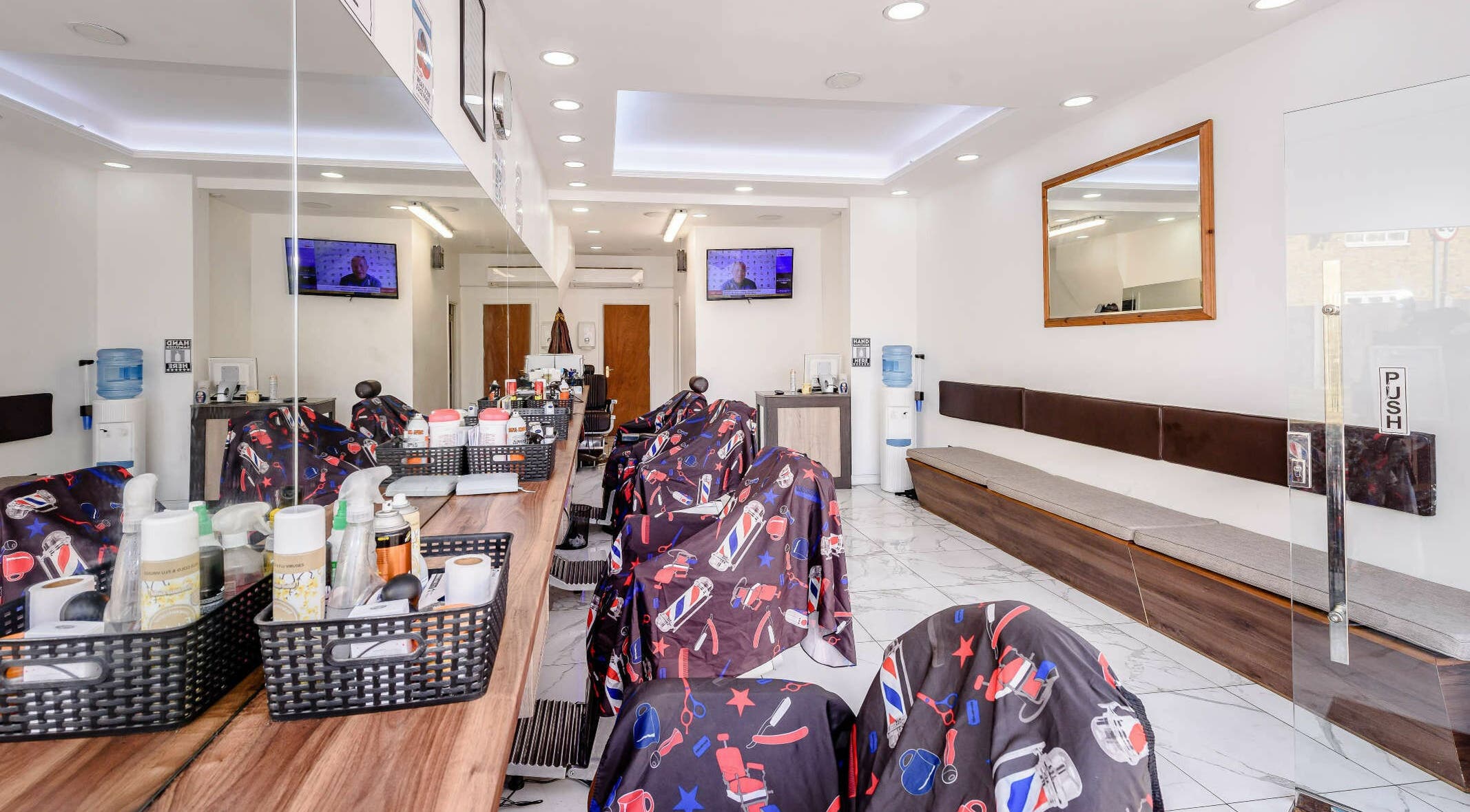 Interior of Clean Cuts London showcasing modern salon chairs and mirrors, located in London, England, GB.