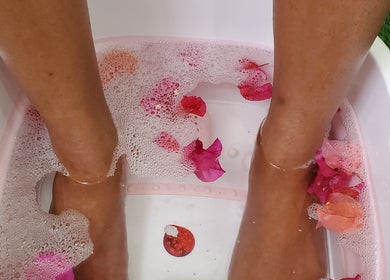 Foot soak with petals at The Finished Look Rodney Bay, Rodney Heights, St. Lucia, JM. Relaxing wellness experience.